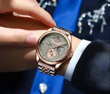 Two-tone Poedagar watch paired with a suit